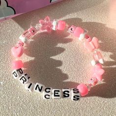 every princess needs this bracelet in their life 👑💗 details ❥ approximately 6.5 inches & super stretchy 🐛 ❥ can be adjusted to your sizing :) 🌈 ❥ want this same design but want it to say something else? i can do that ⚡️ Disney Kandi Bracelets, Cartoon Bracelet Ideas, Rave Candy Bracelets Ideas, Kandi Sayings, Pony Bead Bracelet Ideas, Bracelet Sayings, Scene Bracelets, Bracelets Kandi, Princess Bracelet