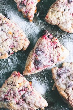 cranberry scones with powdered sugar on top