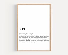 a framed poster with the words kpi in black and white, against a plain background