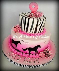 a three tiered cake decorated with zebra stripes and pink flowers