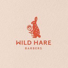 the logo for wild hare barbers, which is designed to look like a rabbit