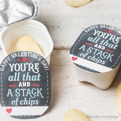 two valentine's day treats in small containers with chalkboard sayings on them