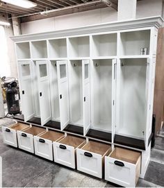 several white lockers with drawers on each side