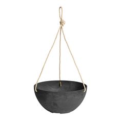 a black bowl hanging from a rope