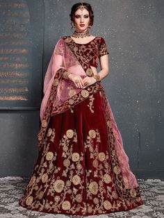 Make heads turn with this majestic maroon colored wedding bridal designer lehenga choli. This stunning outfit is made from velvet silk fabric, offering a luxurious feel and a beautiful drape. The lehenga choli features rich heavy dori, zari, and Sequin embroidery, adding a touch of opulence to the ensemble.
The maroon lehenga is semi-stitched up to 42 inches, allowing you to customize it to your specific measurements. The accompanying choli material is unstitched, providing flexibility in design Purple Lehenga, Engagement Lehenga, Velvet Lehenga, Lehenga Choli Wedding, Party Wear Lehenga Choli, Indian Party Wear, Red Lehenga, Embroidered Velvet, Designer Lehenga