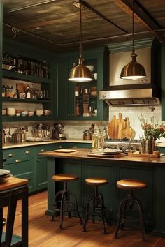 a kitchen with green cabinets and stools next to an island in front of the stove