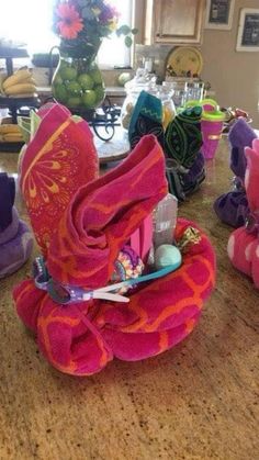 several stuffed animals sitting on top of a wooden table