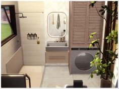 a small bathroom with a washer and dryer next to a plant in a pot