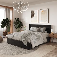 a bedroom with a large bed and potted plants