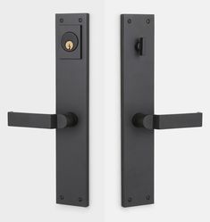 two black door handles with gold knobs on each side and one has a keyhole in the middle