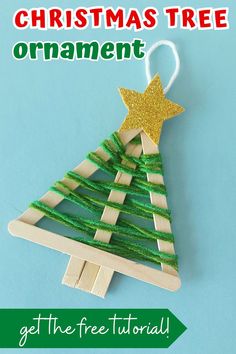 a popsicle christmas tree ornament made out of strips of wood and string