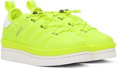 Low-top ripstop sneakers in yellow. Grained leather trim throughout. · Bungee-style drawstring closure · Logo patch at padded tongue · Padded collar · Pull-loop at heel collar · Signature stripes embossed at sides · Logo hardware at outer side · Logo embossed at heel tab · Tricolor flag at heel counter · Grained leather lining · Foam rubber platform midsole · Treaded rubber sole · Platform: H2 in Part of the Moncler x adidas Originals collection. Supplier color: Neon Yellow Sneakers With Elastic Laces For Streetwear, Spring Sneakers For Light Sports, Nylon Material, Spring Nylon Sneakers For Light Sports, Casual Adidas Nylon Sneakers, Sporty Spring Nylon Sneakers, Green Nylon Sneakers For Spring, Adidas Nylon Sneakers For Streetwear, Sporty Yellow Nylon Sneakers, Sporty Adidas Logo Sneakers In Nylon