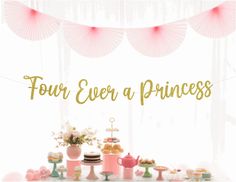 four ever a princess party with pink and gold decorations on the table, including cupcakes