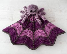 an octopus crocheted bag hanging on the wall