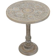 an old wooden table with ornate designs on it's top and base, isolated against a white background