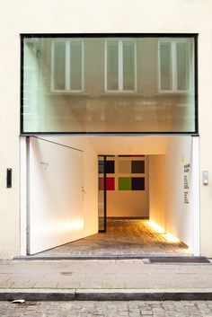 an open garage door on the side of a building