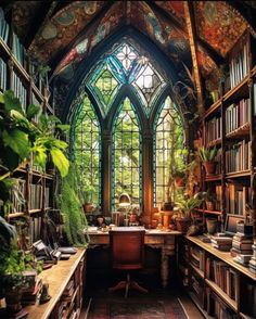 a room filled with lots of books next to a tall window covered in green plants