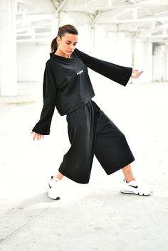 "Streetwear Outfit, Black Sweatsuit, Women Sweatshirt ◈ Stylish and chic fashion is our shared dream! You can be sure that this piece is made with a lot of love and craftsmanship. ◈ S I Z I N G ◈ The model wears size S. This item is available from XS to 4XL. Please, have a look at my Size Chart below before placing your order. The model in the picture is 63'' (160 cm) tall. ◈ D E L I V E R Y ◈ This item will be shipped in up to 5 days after your order was placed. We use Express worldwide shippin Black Sportswear Pants For Spring, Black Wide Leg Pants With Elastic Cuffs, Black Pants With Ribbed Cuffs For Winter, Black Wide-leg Pants With Elastic Cuffs, Black Loungewear Sets For Winter, Black Winter Pants With Ribbed Cuffs, Black Pants With Elastic Cuffs For Fall, Black Pants With Elastic Cuffs For Spring, Black Hooded Cotton Set