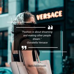 a woman walking down the street carrying a white bag with a quote about fashion is about dreaming and making other people dream