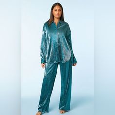 A Knit Set Featuring A Shirt With A Basic Collar, Button-Front Closures, Allover Ribbed Construction, Dropped Long Sleeves, Dolphin Hem, And A Metallic Finish, As Well As A Matching Pair Of Pants With A High-Rise Elasticized Waist And Wide Leg. Bust Is 25 Inches Across (Oversized). Small Waist Is 13.5 Inches. Medium Waist Is 15 Inches. This Is Fantastic! I Kept One And Wore It For New Years. So Pretty. So Comfy. Lots Of Compliments. Small Inventory Box #V22 Medium Inventory Box #V23 Oversized Blouse For Loungewear With Button Closure, Oversized Loungewear Blouse With Button Closure, Chic Blouse With Buttons For Loungewear, Blue Blouse For Fall Loungewear, Blue Fall Loungewear Blouse, Blue Button-up Blouse For Loungewear, Oversized Blouse, Knit Set, Pair Of Pants