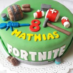 a birthday cake with fondant decorations on it