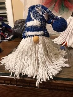 two white and blue mop heads sitting on top of a table