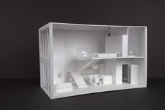 a cut out model of a house with stairs