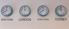 four clocks with different time zones on the side of a wall that says new york, london, hong kong and sydney