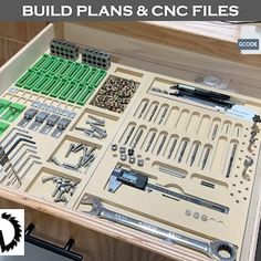 an open drawer with tools in it and the words build plans & cn files