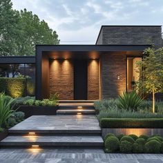 a modern house with steps leading to the front door