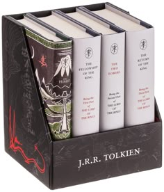 four books in a book holder with the title j r r tolken on them