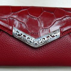 Brighton Mingle Small Red Croc Leather Envelope Wallet Crossbody Nwt Wallet Crossbody Width: 6 1/4" Height: 4" Depth: 1/2" Exterior Material: Leather Back Slip In Pocket Snap Closure Small Slip In Pocket Under Snap Zip Pocket Inside Middle 2 Slip In Pockets - One With Id Holder Adjustable Crossbody Strap Msrp $95 Loc E & P Elegant Red Bifold Coin Purse, Elegant Red Wallets With Card Slots, Elegant Red Clutch Wallet, Elegant Burgundy Bifold Wallet, Leather Envelope, Envelope Wallet, Croc Leather, Id Holder, Crossbody Strap