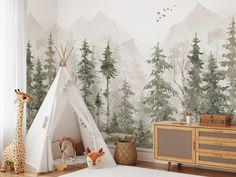 a child's room with a teepee tent and wallpaper that has trees on it