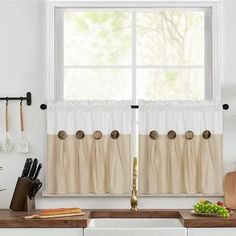 a kitchen with a sink, counter and window