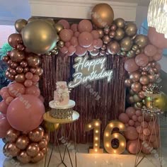 a birthday party with balloons, cake and decorations