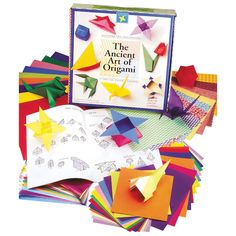 the ancient art of origami book is open to reveal an assortment of colorful papers