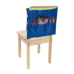 a wooden chair with a blue back filled with school supplies