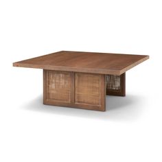 the table is made from wood and has rattan panels on it, along with an open drawer for storage