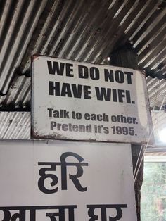 two signs that say we do not have wifi talk to each other pretend it's 1989