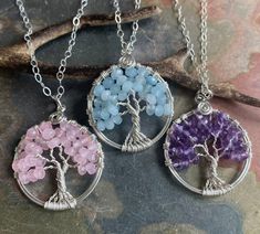 "These  Tree of Life Pendant necklaces are wire wrapped with gorgeous AAquamarine, Pink rose Quartz, Amethyst  and  .925 Sterling Silver wires for the outer ring & 99.9 % fine silver wire for the tree trunks an branches.  These lovely necklaces are smaller in sizes. They are slightly larger than US quarter coin.  please choose the desired tree necklace in the drop down menu. ~~The pendants measures about between 1.25 to 1.30 inch in diameter.  ~~The pendant  comes on a .925 Sterling Silver cable chain & finished with a lobster clasp. ~~  Each pendant is handmade, so please allow slight variations from the shape of the branches and placement of the stones as shown The Tree of Life is a universal symbol found in many spiritual traditions around the world. The tree of knowledge, connecting to Celtic Knot Necklace, Star Garnet, Amethyst Healing, Pink Rose Quartz, Tree Necklace, Silver Tree, Rose Quartz Stone, Tree Of Life Necklace, Tree Of Life Pendant