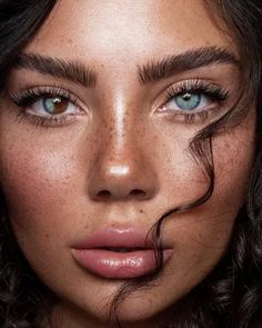 a close up of a woman with freckles on her face