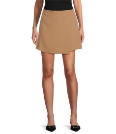 From Gianni Bini&#x2C; this skirt features:Faux wrap silhouetteMini lengthStretch suitingInvisible back hook and zip closureApprox. 15.25" in lengthPolyester/rayon/elastaneDry cleanImported. Spring Workwear Skirt With Side Zipper, Short Skirt With Side Zipper For Work, Chic Fitted Wrap Skirt For Work, Chic Short Wrap Skirt For Work, Fitted Skort With Side Zipper For Work, Spring Workwear Mini Wrap Skirt, Fitted Asymmetrical Skort For Work, Workwear Mini Skirt With Side Zipper, Chic Workwear Mini Skirt With Side Zipper