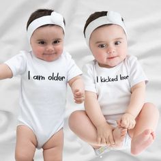 Twins Onesies, Funny Twin Onesies For Babies, Twin Baby Onesies, Twins Outfits Baby, Twins Baby Gift, Twin One Twin Two, Twins Gift The Baby Rib Bodysuit is outstanding as the most basic and comfortably garment for your baby's wardrobe. It will act smoothly and never cause irritation due to its 100% combed ringspun cotton makeup (composition differs by color). - Comprised of 100% combed ringspun cotton, offering a soft and comfortable fabric - Heathers are made with a blend of 90/10 combed ringspun cotton/polyester for a balanced combination of comfort and durability - Granite Heathers feature a blend of 60/40 combed ringspun cotton/polyester, providing a unique and stylish appearance - White bodysuits are sewn using 100% cotton thread, ensuring quality and attention to detail - Light fabr White Family Matching Onesie For Playtime, White Cotton Birthday Set, White Sets With Letter Print For Birthday, Personalized White Onesie For First Birthday, Customizable White Onesie For Playtime, Cute White First Birthday Sets, Playful White Sets For First Birthday, Cute Onesie For Playtime On Mother's Day, White Onesie For First Birthday On Mother's Day