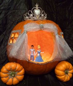 a pumpkin with a princess and prince on it