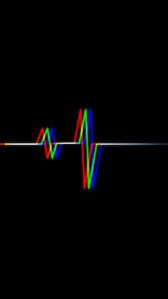 an image of sound waves in the dark with colored lights on them and black background