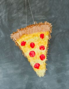 a piece of pizza hanging from a string