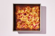 a square pan filled with food on top of a white table