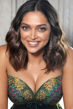 a woman in a green dress posing for the camera