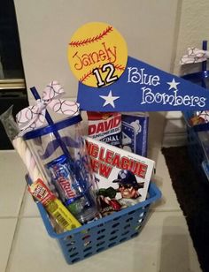 a blue basket filled with sports items on top of a counter