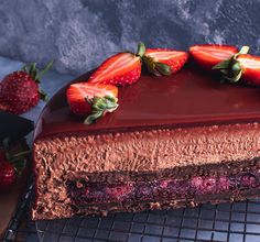 a chocolate cake with strawberries on top